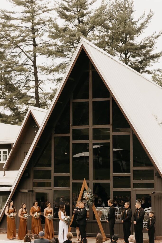 Wedding party in front of lodge