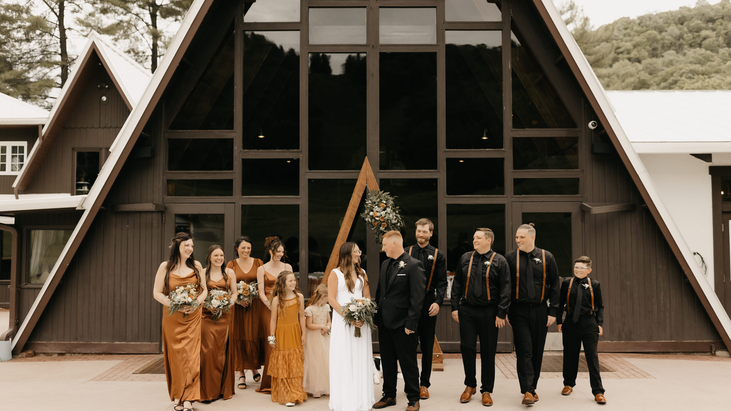 Wedding party in front of the lodge