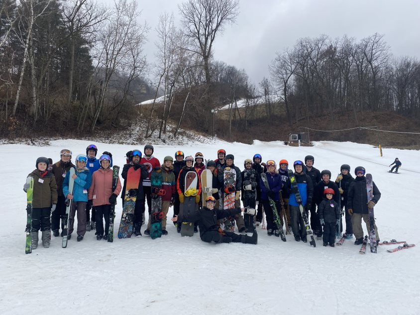 Ski and snowboarders in group photo